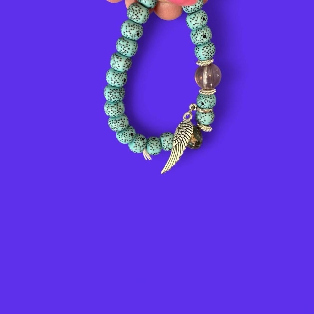 Greenish and silver boho beaded bracelet with Charms